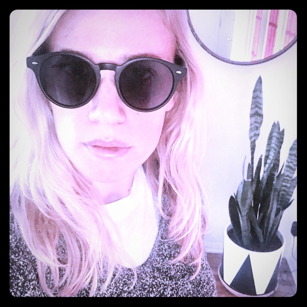 UO brand black matte frame sunglasses.