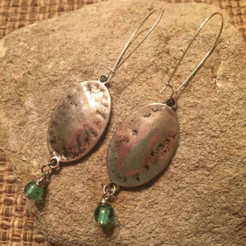 Handcrafted silver tone dangles.