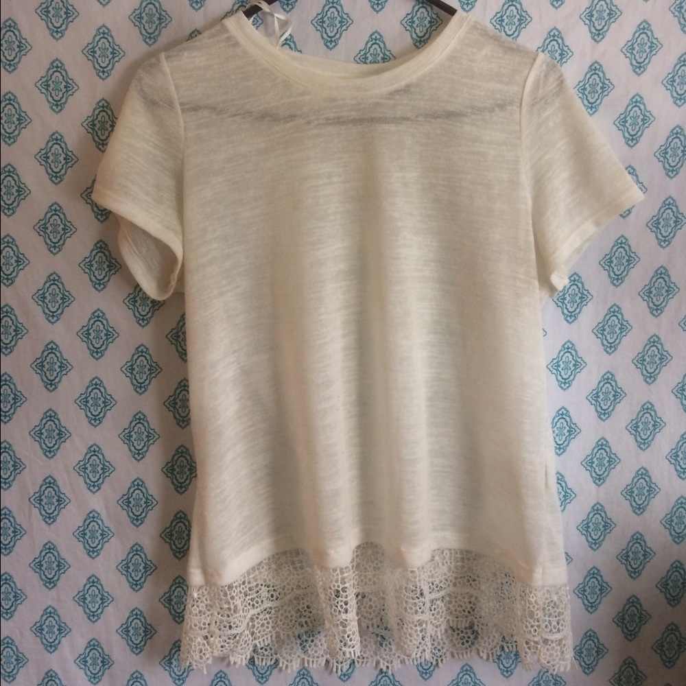 White shirt with lace detail at the bottom