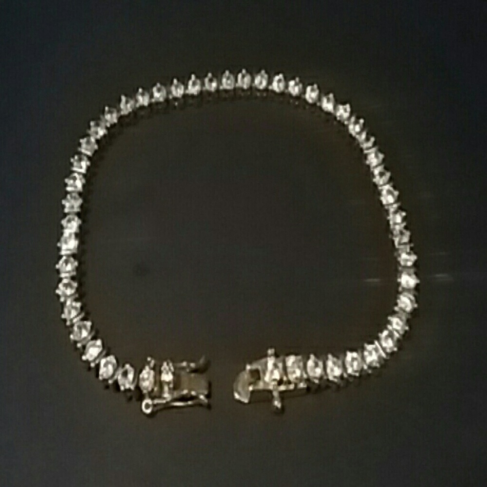 Gold tone tennis braclet