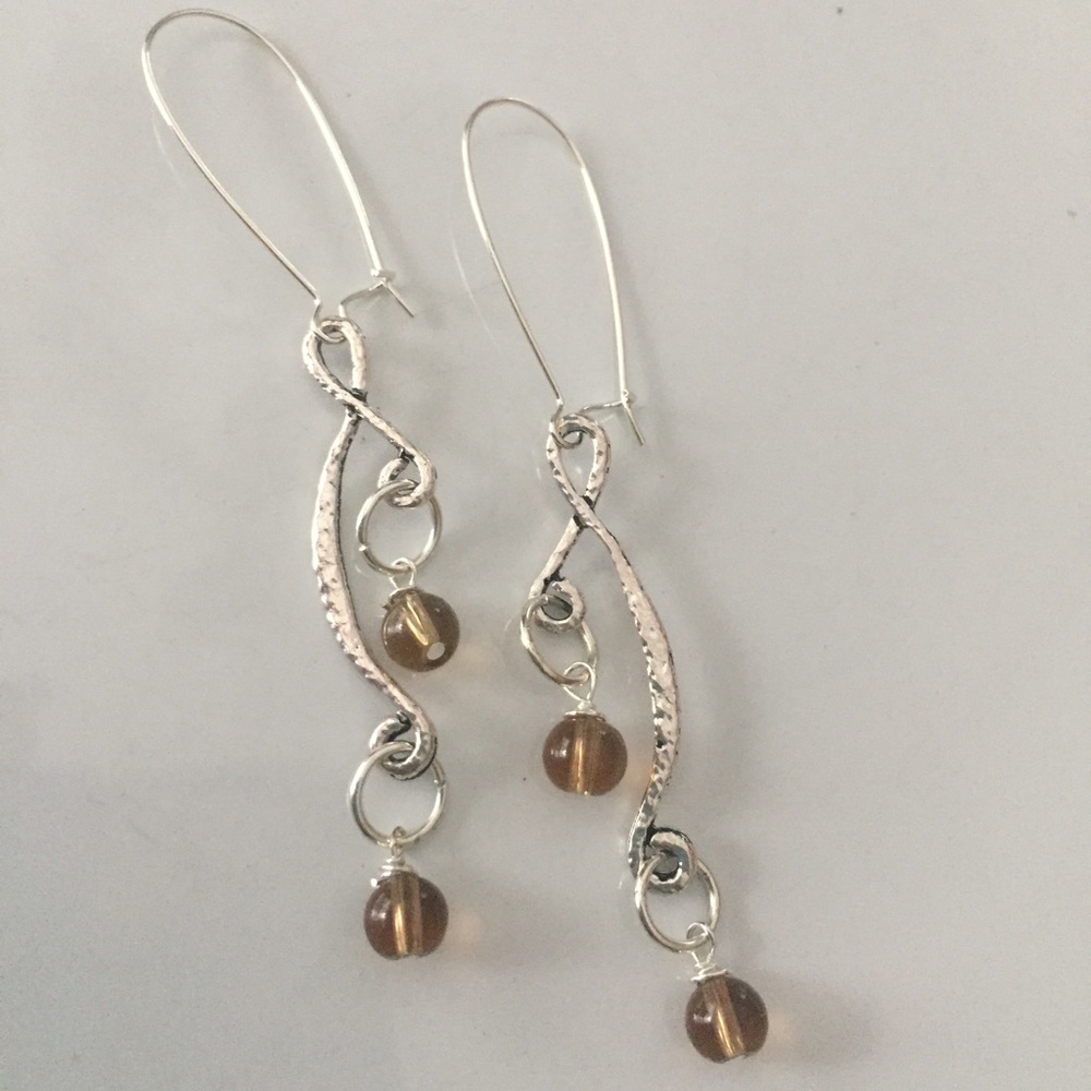 Silver tone dangles, translucent brown beads