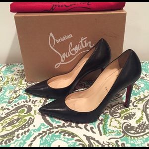 Christian Louboutin black pumps.