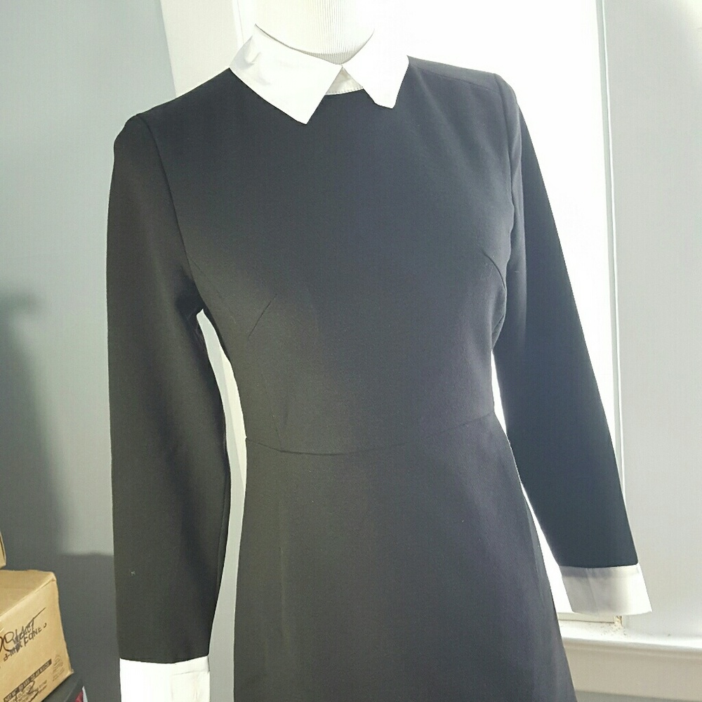 Black dress with white collar and cuffs