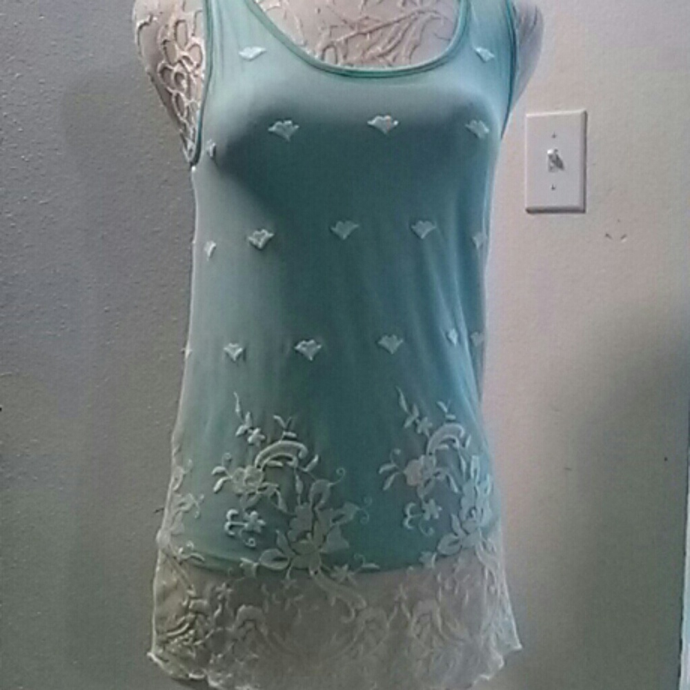 Beautiful mint green top. Julie's closet