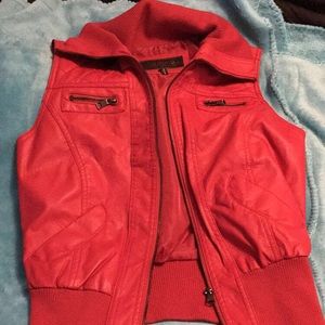 Red vest. Feaux leather.