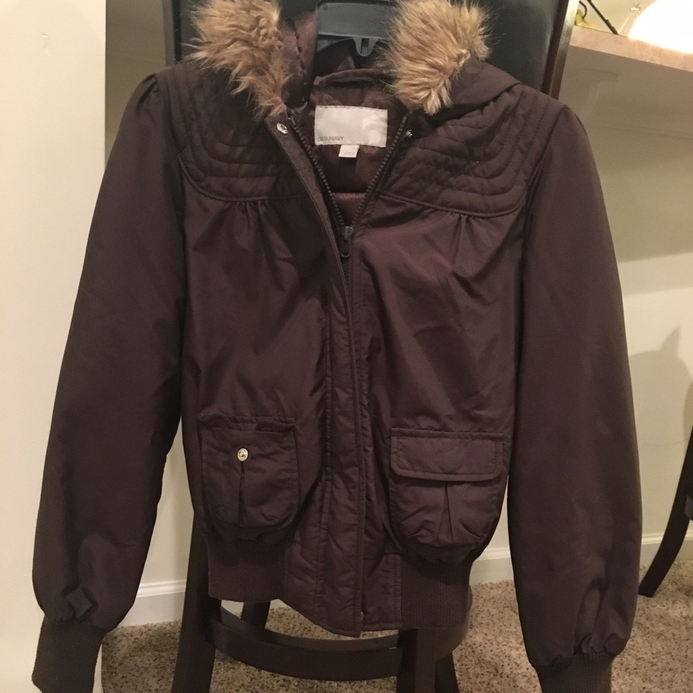 Brown, short, light-weight puffer coat.