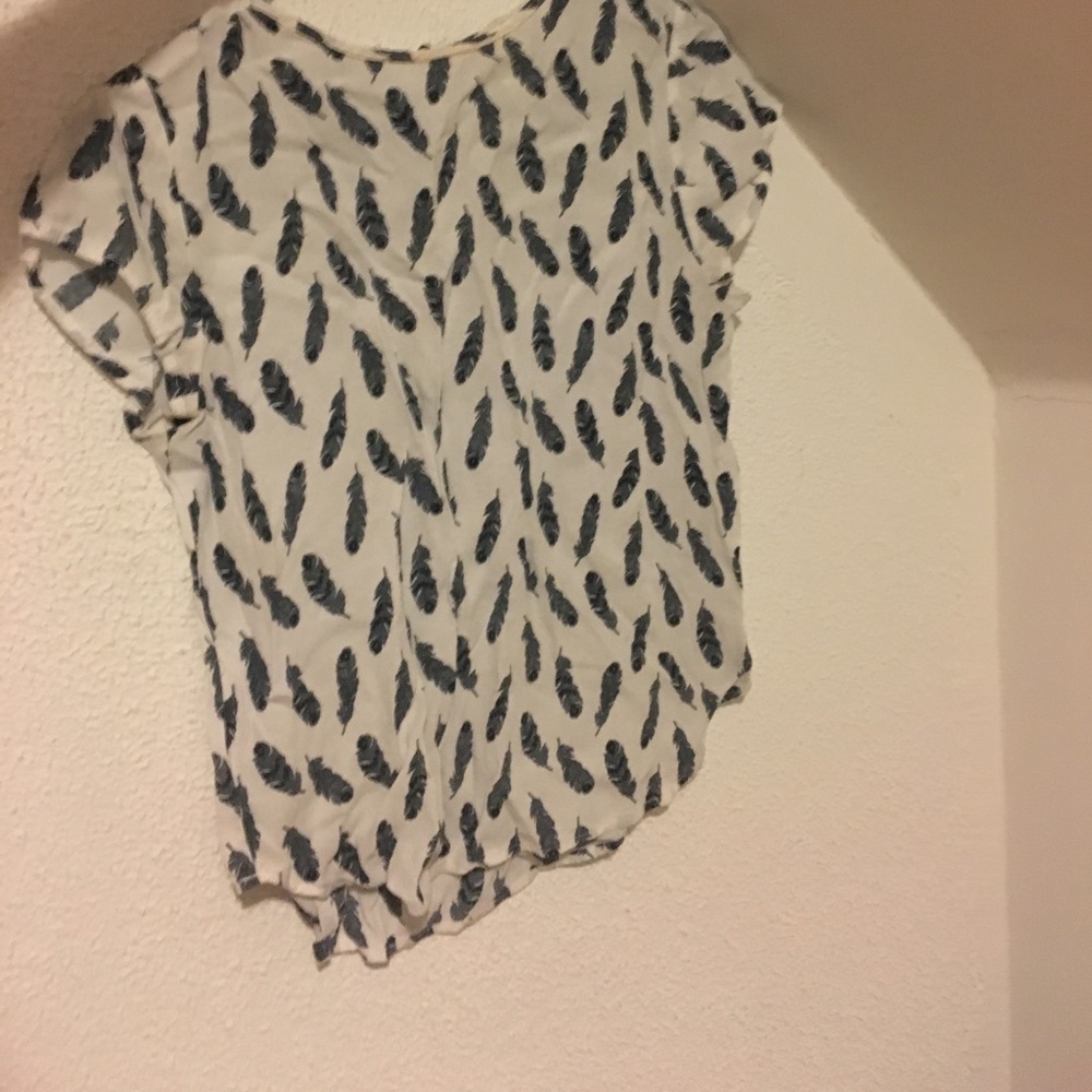White blouse with feathers