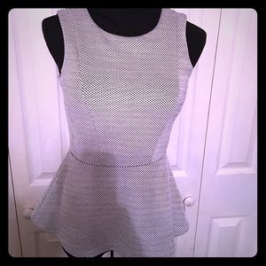 Sleeveless peplum black and white top