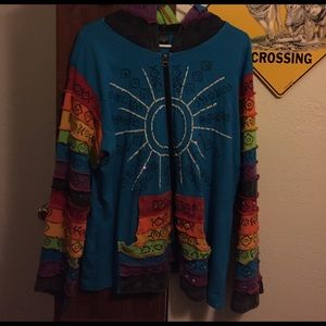 An XL blue/rainbow sweater.