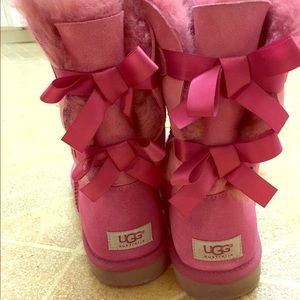 Hot pink UGGs with laced bows