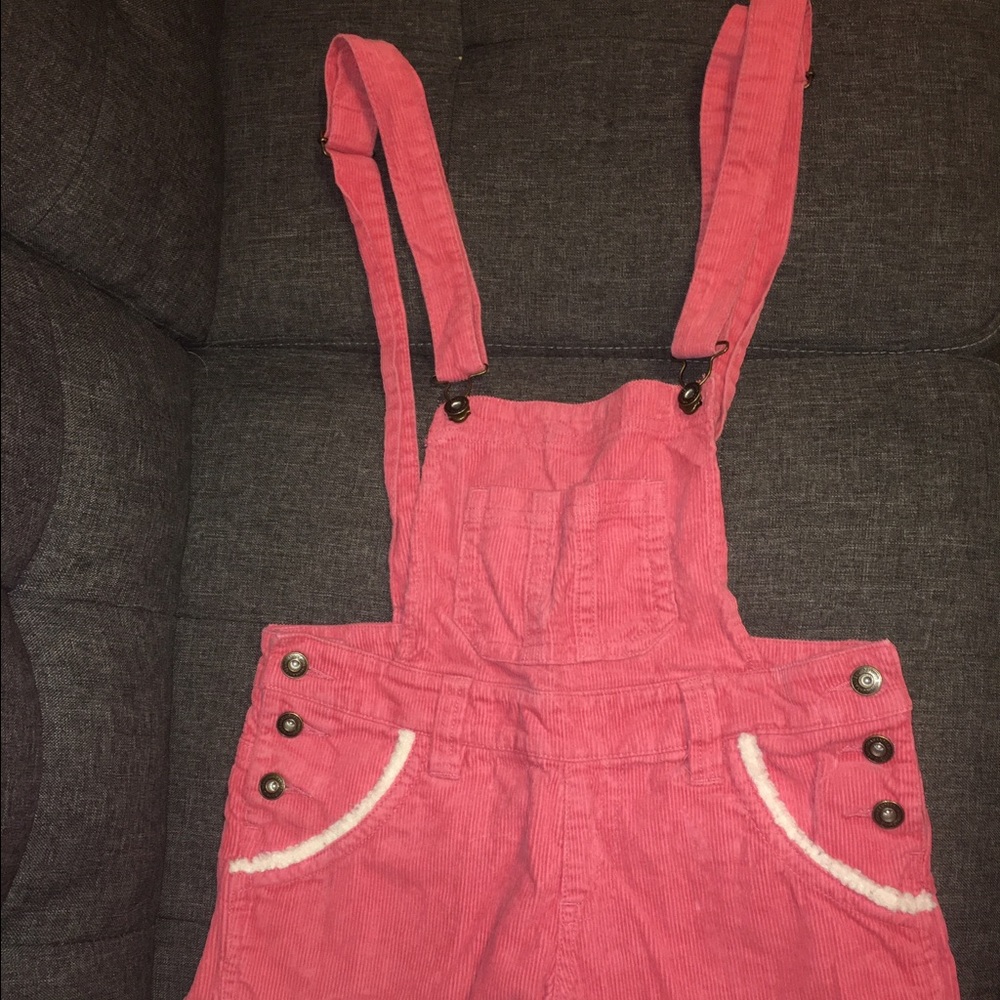 Pink corduroy overall shorts with fleece trim
