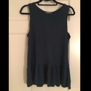 Navy blue tank top with a ruffled bottom.