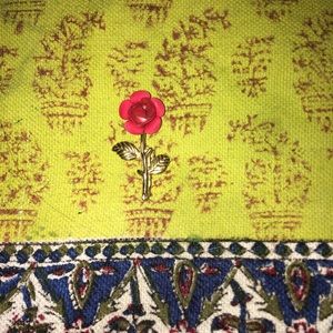 Rose and gold colored broach, pin.