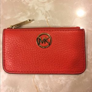Orange Michael Kors coin purse with keyring