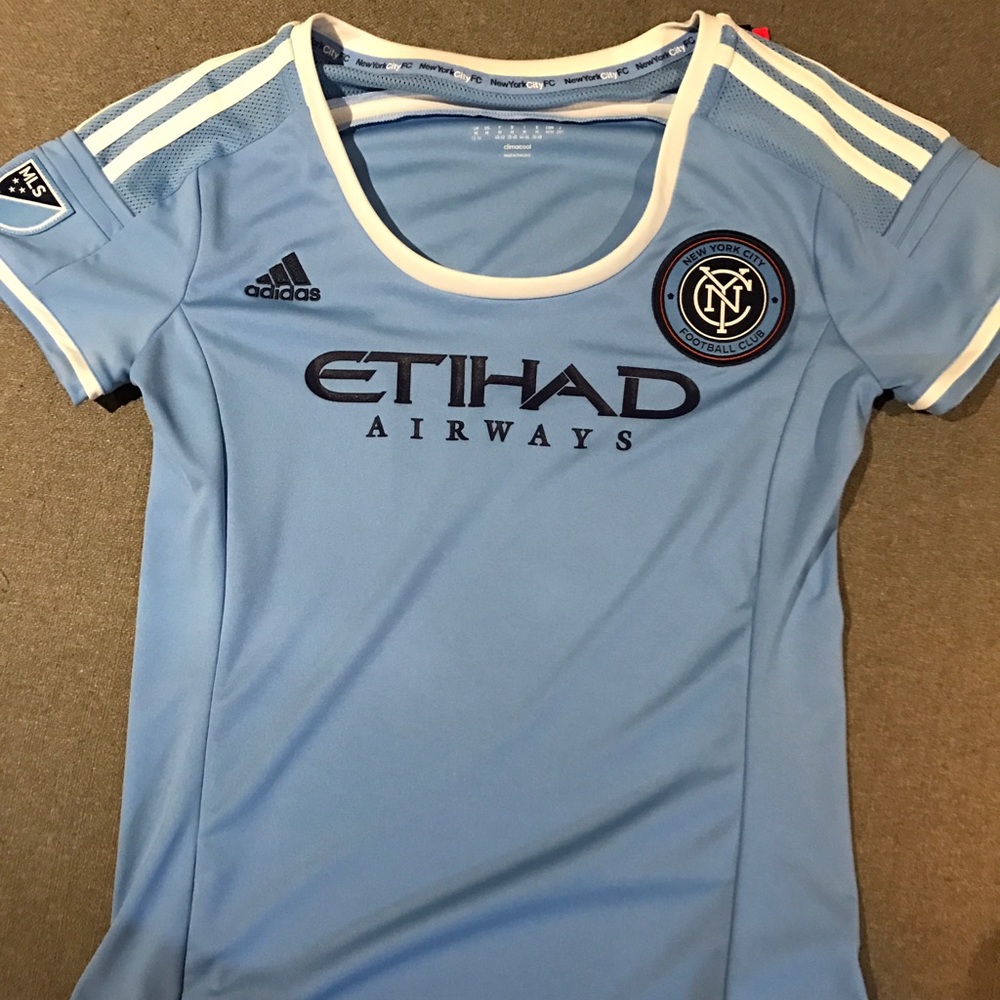 Blue and white adidas Ethad Airways soccer jersey
