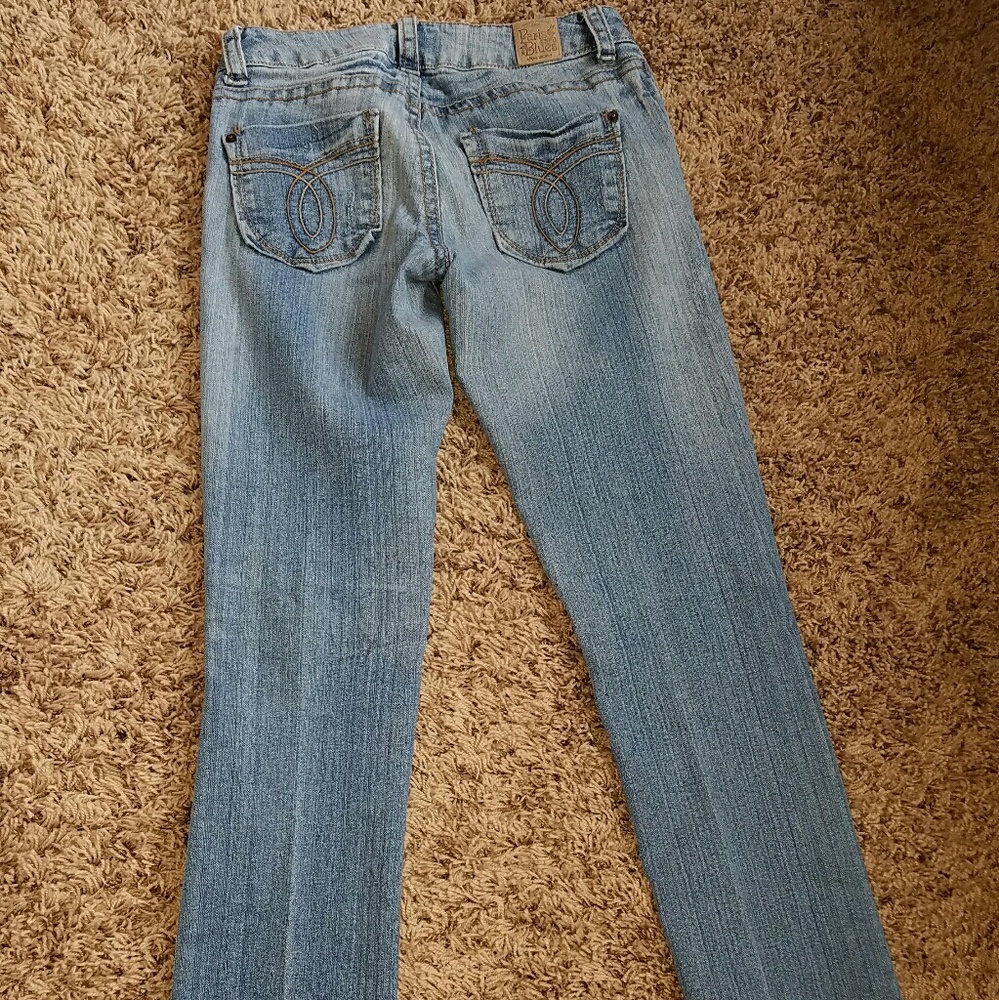 Designer ripped leg skinny jeans