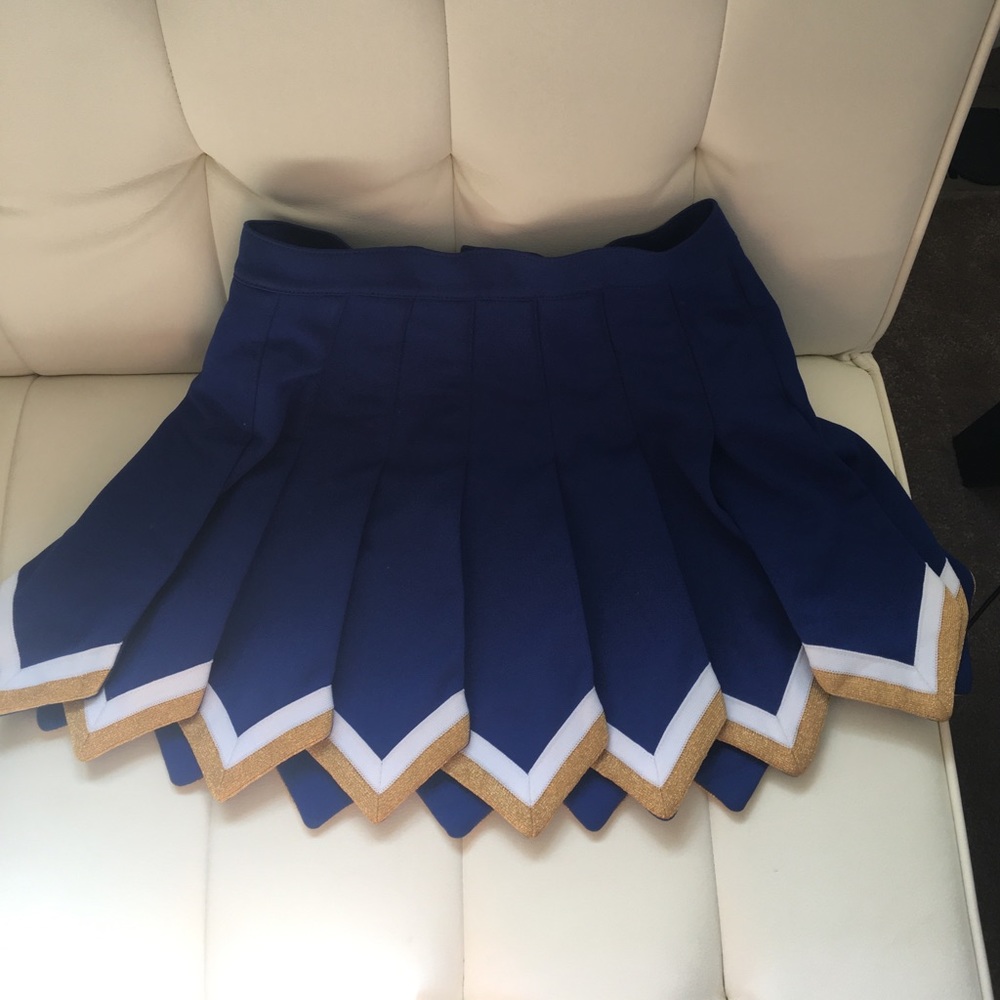 Blue cheerleading skirt with white and gold trim!