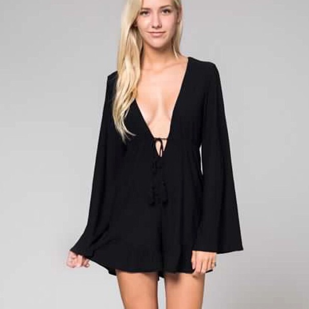 NWT LONG SLEEVE LOW CUT ROMPER