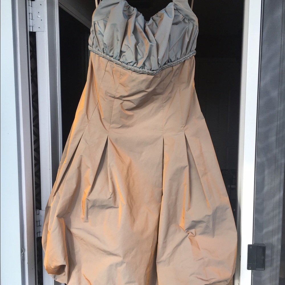 Shimmering bronze cocktail dress with a jacket.