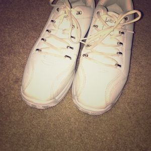White pair of fubu shoes