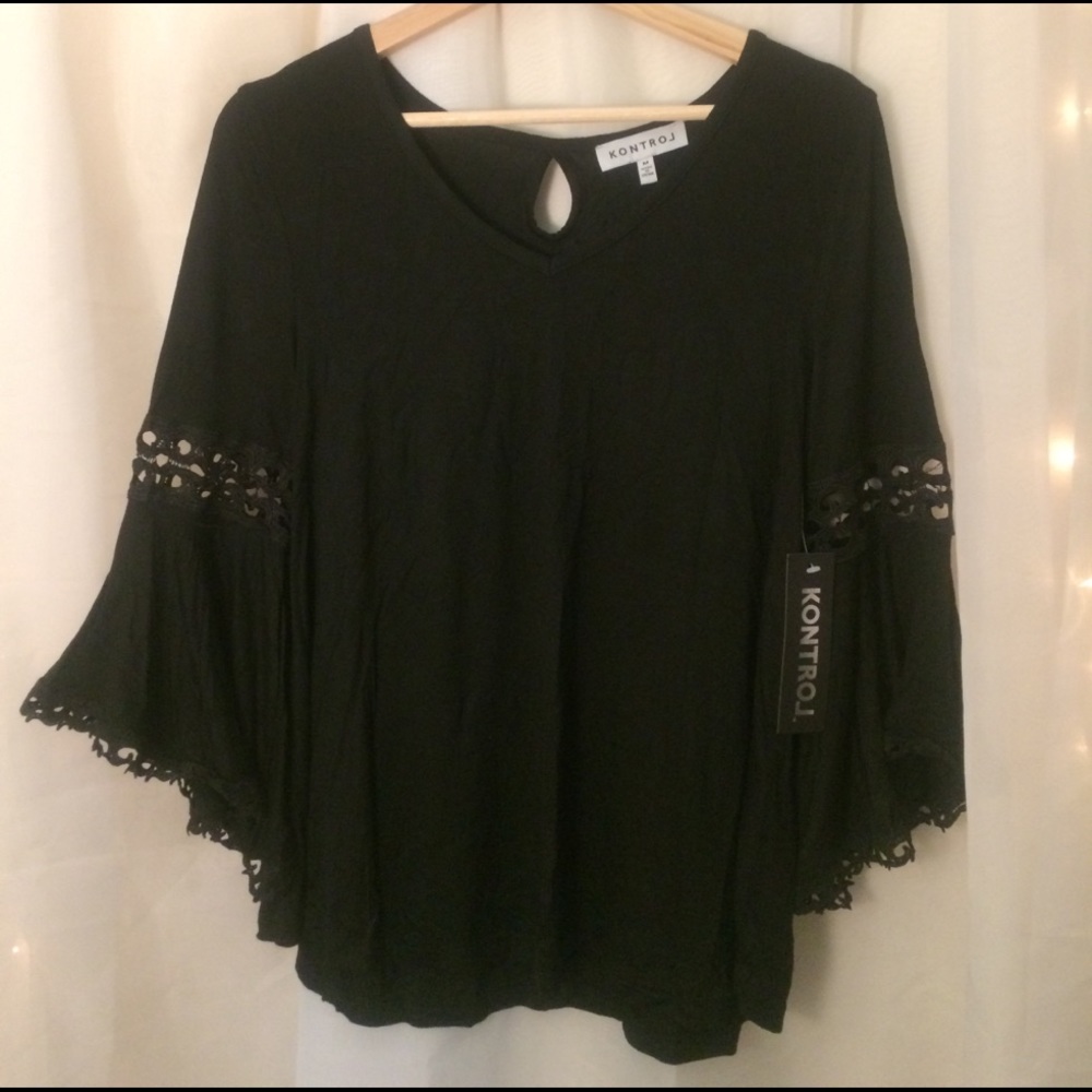 Long, bell sleeved black blouse