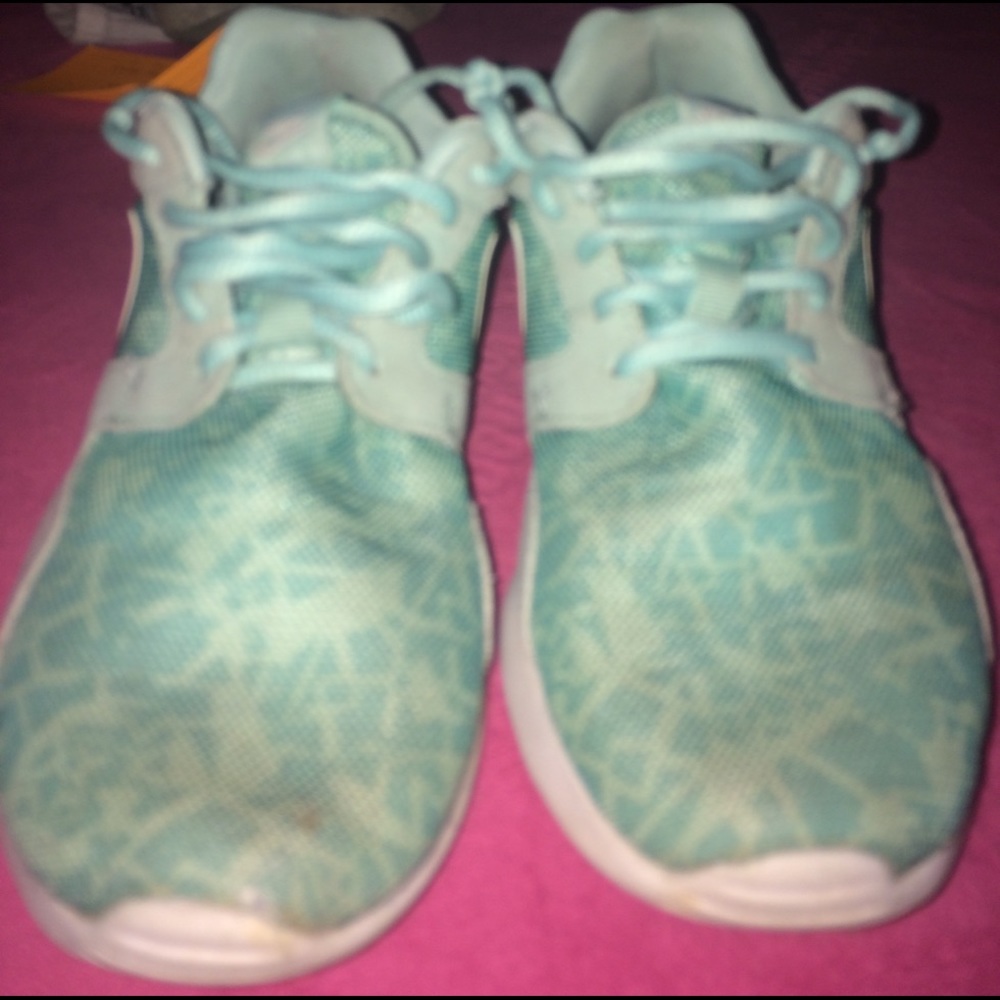 Aqua designed Nike tennis shoes.