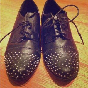 Snazzy oxfords with rounded stud details.