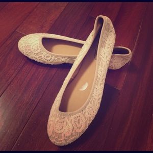 Cream colored flat shoes