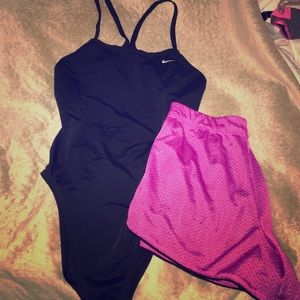 Nike one piece bathing suit and pink shorts