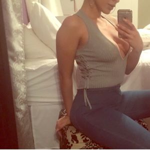 Tie up low plunging grey body suit.