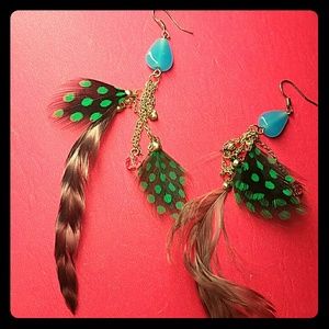 Feather earings with blue jem