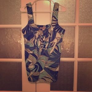 Blue and white print sleeveless blouse