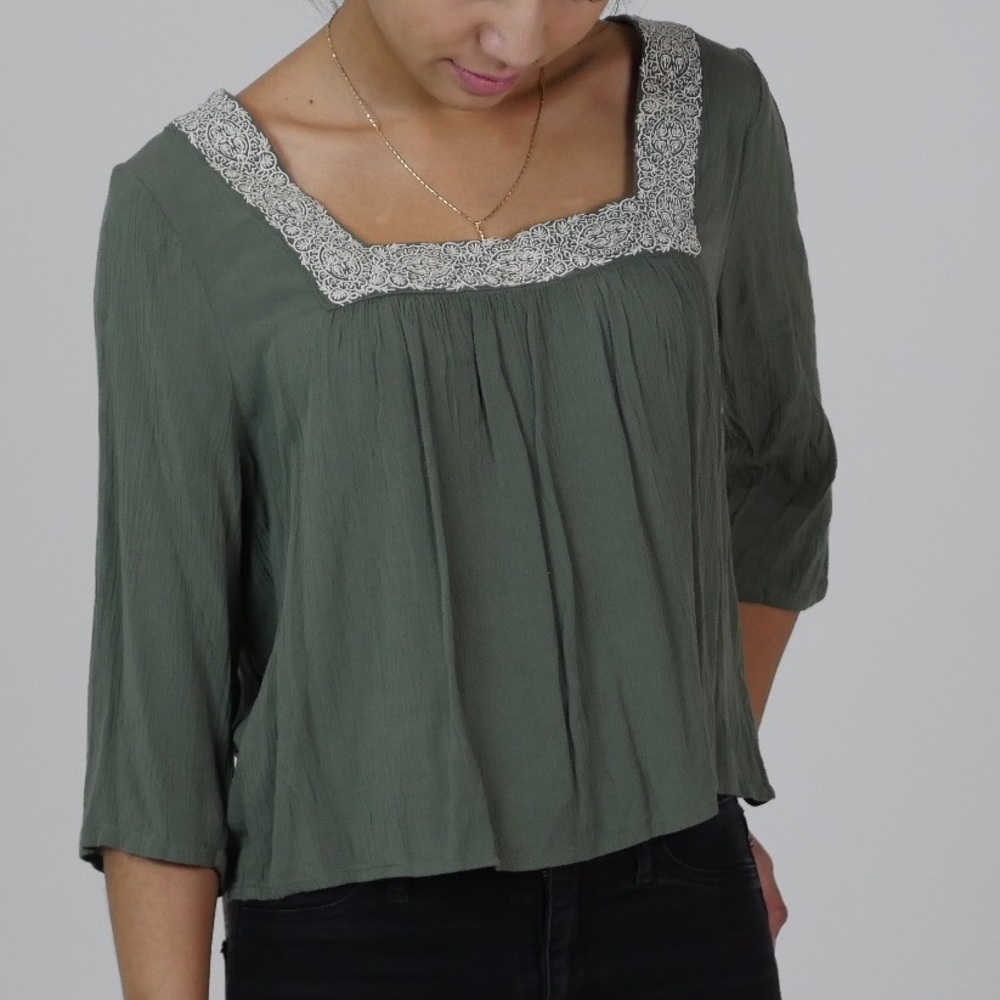 Green loose top with neck detail from Pacsun