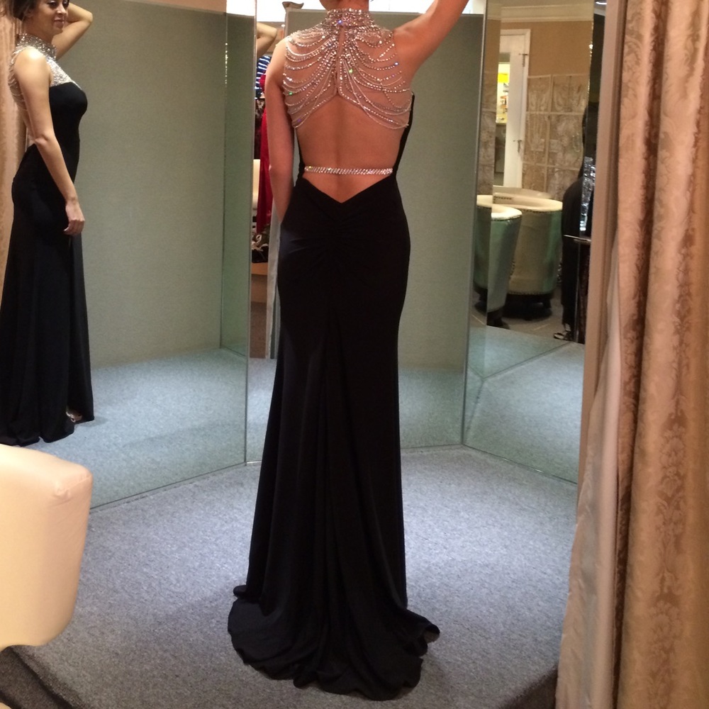Gorgeous and unique Black backless evening dress.