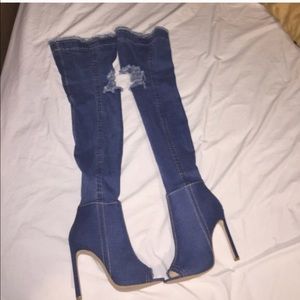 Distressed denim boots