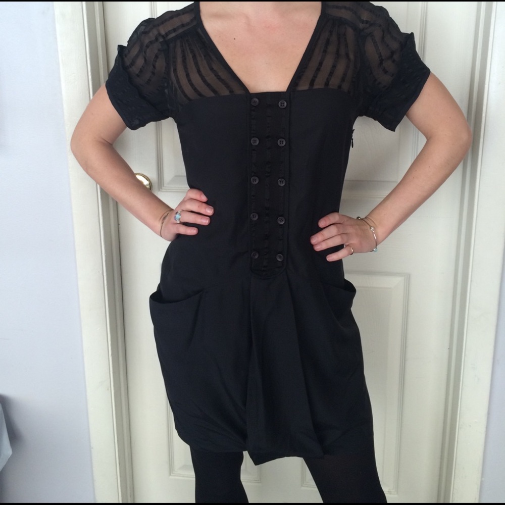Black slip dress with sheer striped top.
