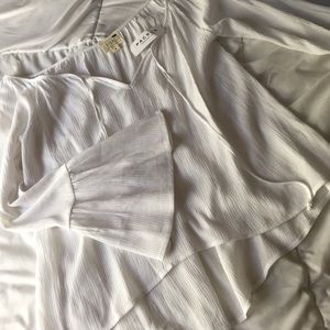 White flowy bell sleeve top