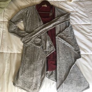 Grey long sleeve top.