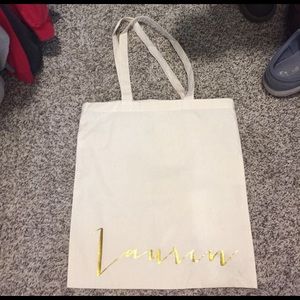 Canvas tote with the name Lauren on it.