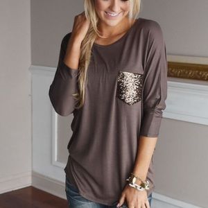 Long sleeve brown shirt, with glitter pocket.