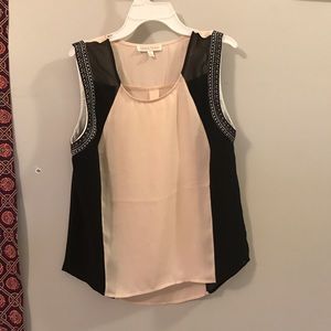 tan and black top with  bordering on sleeves