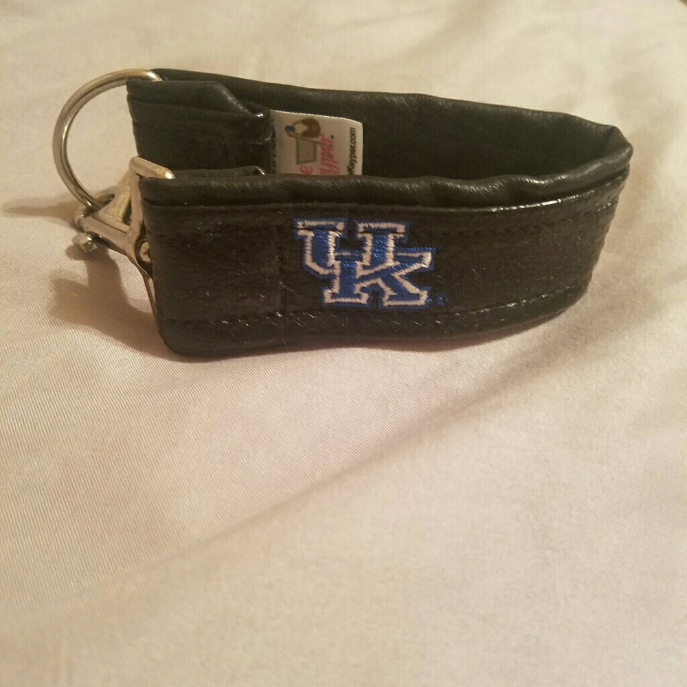 UK logo wrist cuff to carry a purse or whatever