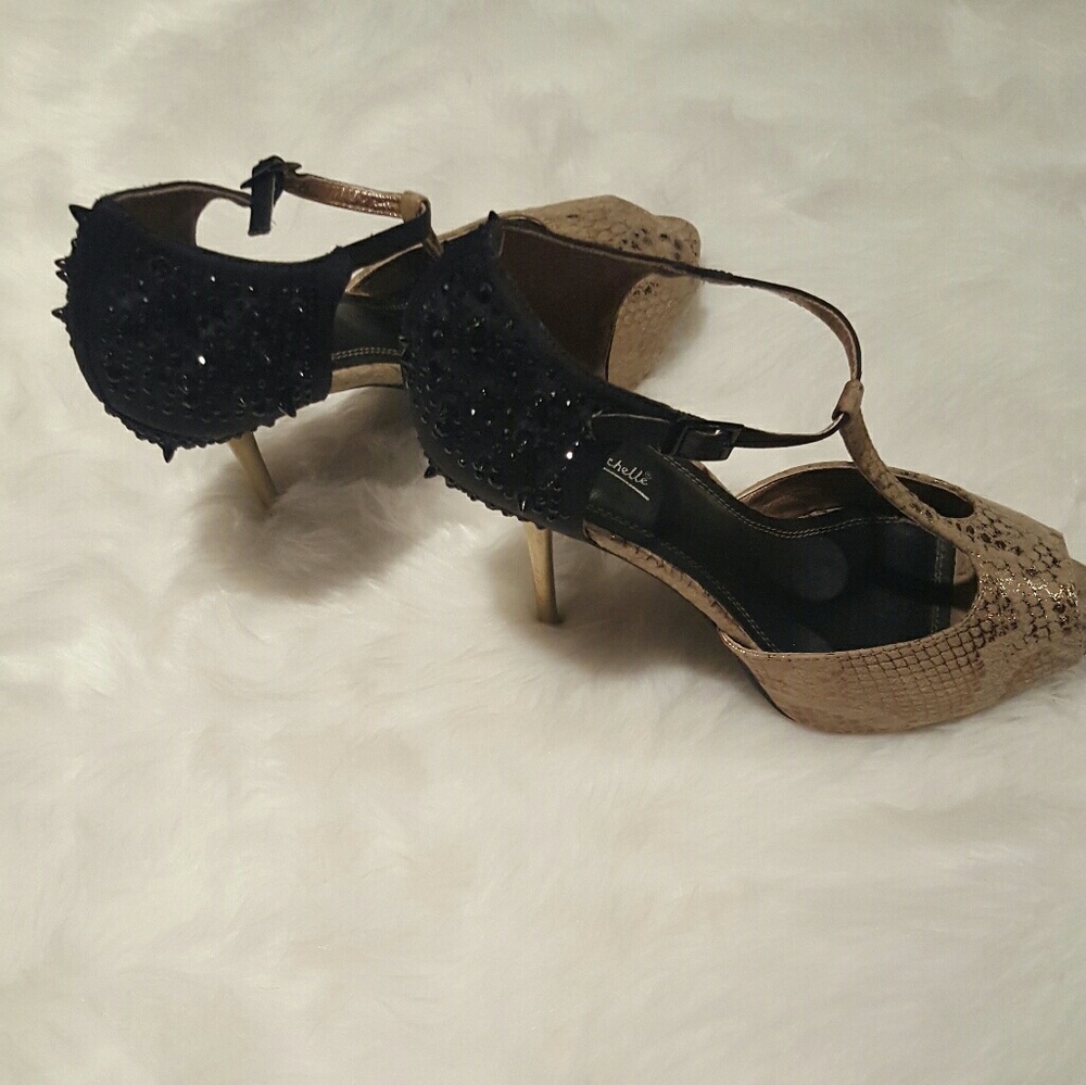 Gold and black spikes heels