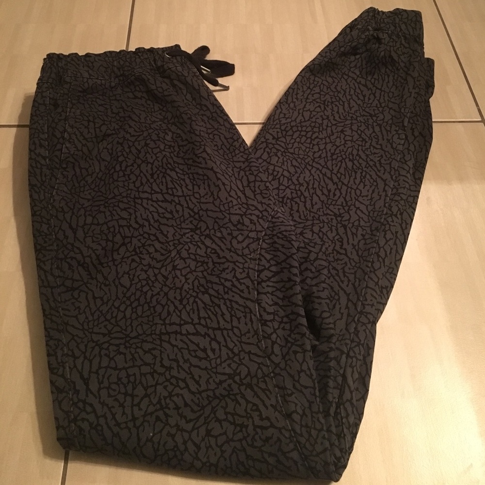 Gray and black joggers with with tie up at waist