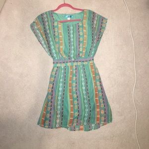 Turquoise patterned dress.