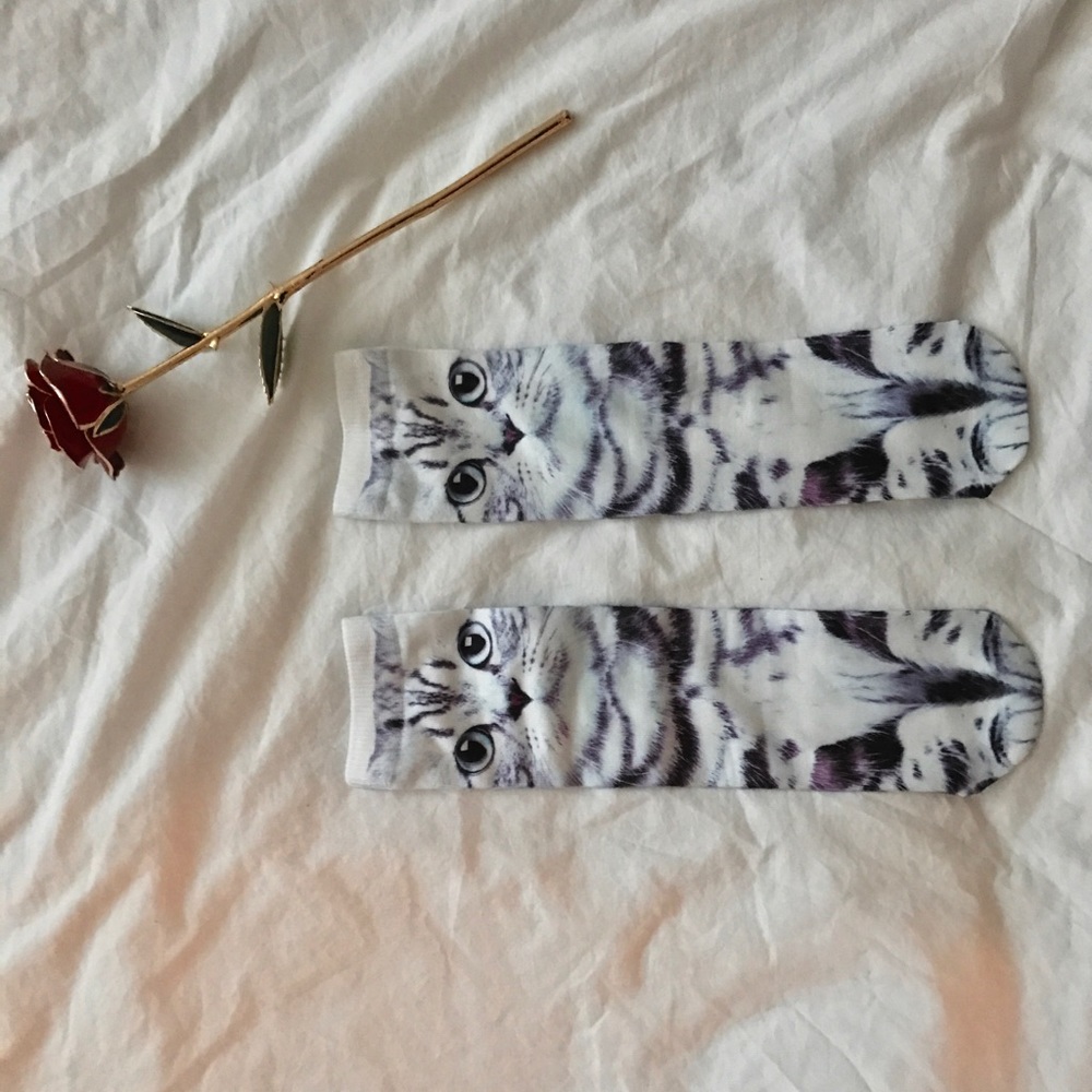 a pair of socks with kitty on both