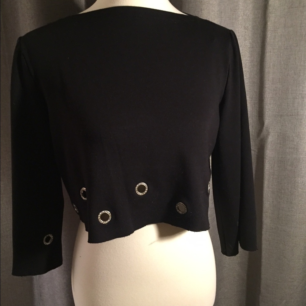 Black crop top with rhinestone hole detail.