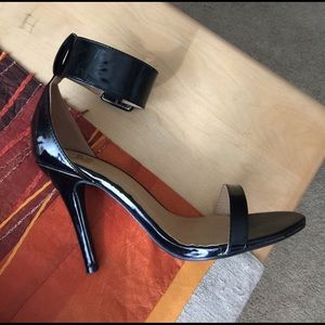Black high heels, 5" heel.