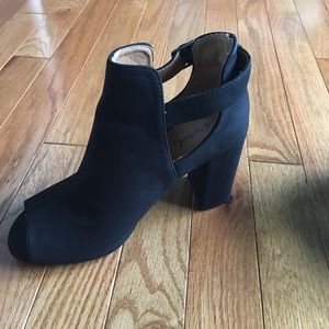 Black heeled booties with open toe