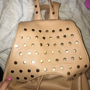 GOLD STUDDED BACK PACK USED ONCE